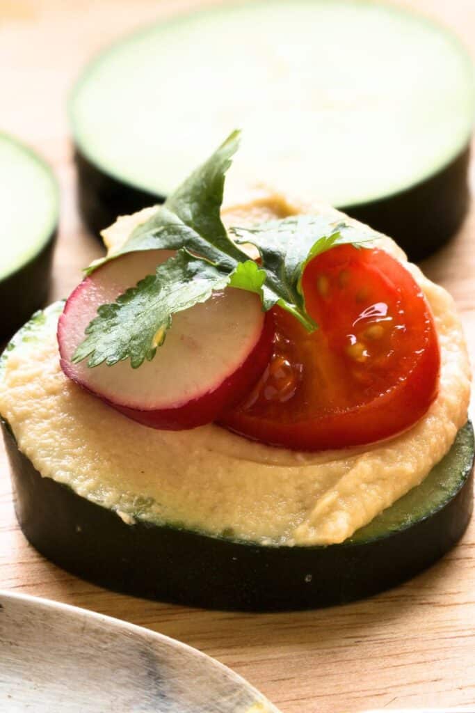 Cucumber rounds topped with hummus, sliced radish, cherry tomato, and fresh herbs. A light and refreshing appetizer that’s easy to make and perfect for baby showers, birthday parties, or healthy snacking.