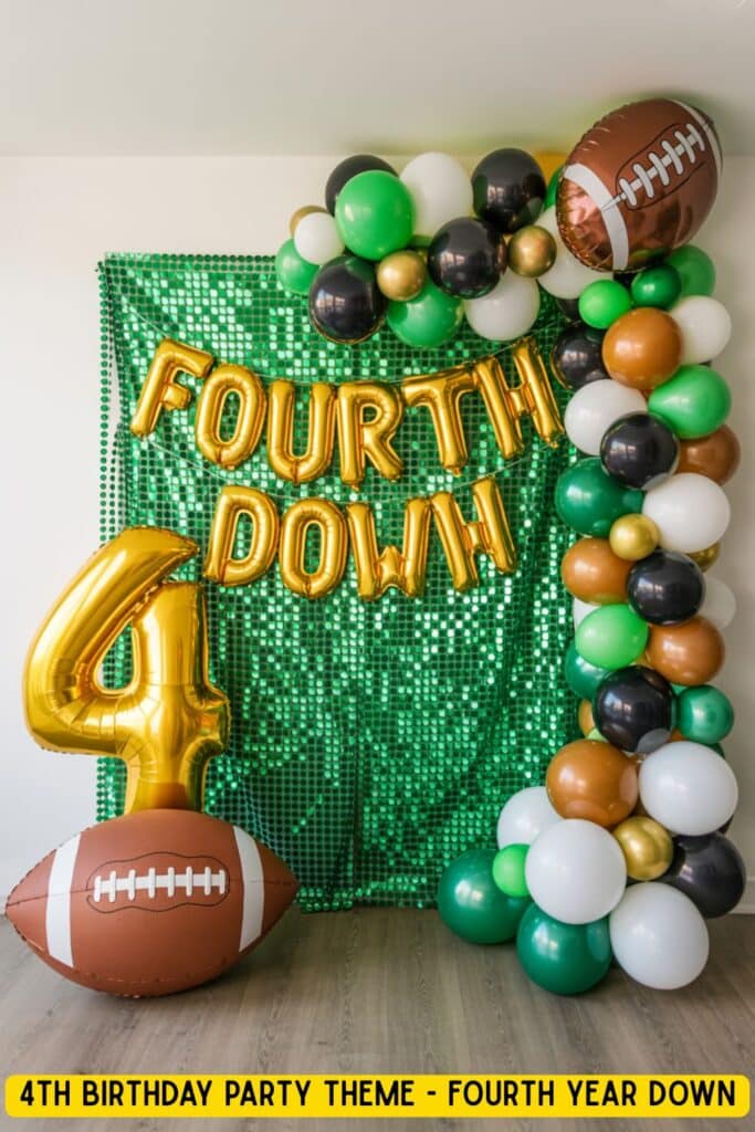 Football-themed 4th birthday party setup with green sequin backdrop, gold balloon letters spelling “FOURTH DOWN,” a gold number 4 balloon, football balloons, and a balloon arch in brown, green, white, black, and gold.