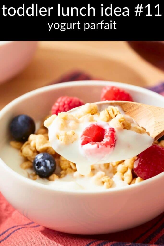 Yogurt parfait with raspberries, blueberries, and low-sugar granola — an easy, high-protein toddler lunch idea that’s picky-eater friendly.