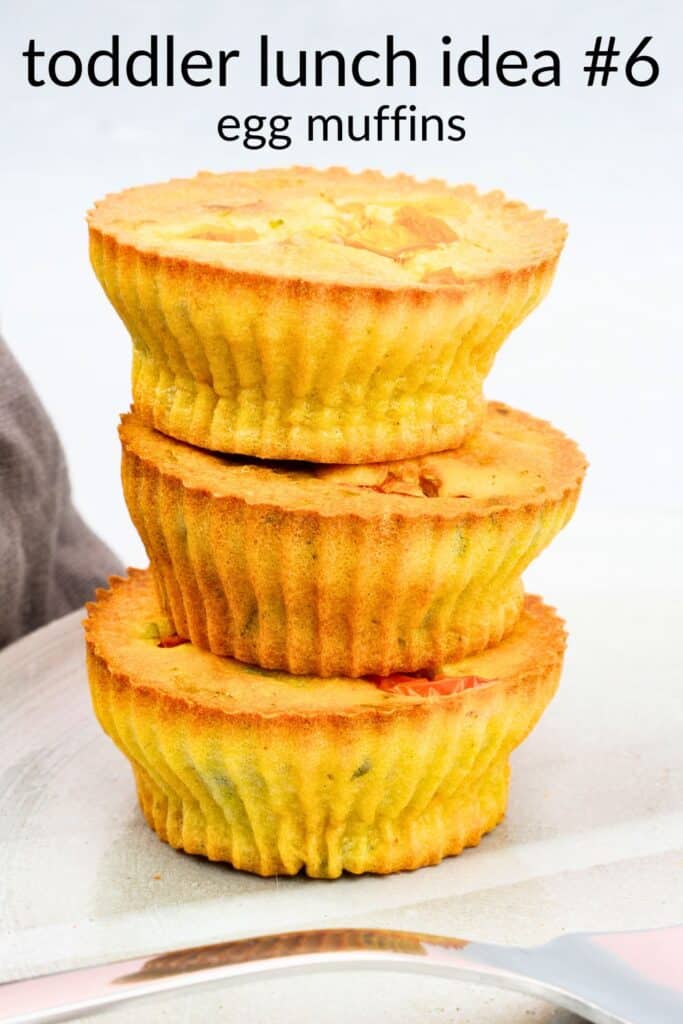 Stack of baked egg muffins in silicone cups — an easy, high-protein toddler lunch idea and make-ahead finger food for daycare.