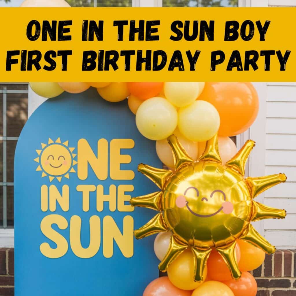 One in the Sun boy first birthday party decor featuring a sunshine backdrop, gold sun balloon, and yellow and orange balloon garland, perfect for a summer first birthday party, outdoor birthday celebration, and first birthday theme ideas for boys