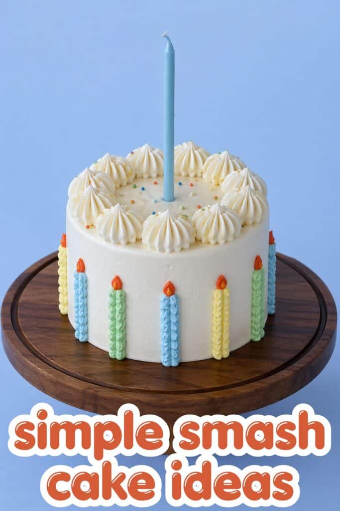 simple smash cake first birthday white cake with piped frosting and single blue candle minimal design